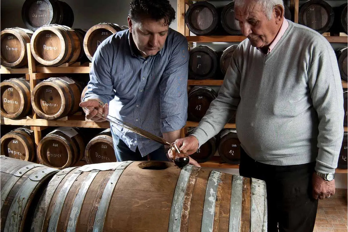 Artisan balsamic vinegar tasting in Italian acetaia with wooden barrels at Nostrale Gourmet.