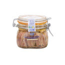 Filetti di acciughe del Mar Cantabrico immersi nell'olio extravergine di oliva, presentati in un barattolino di vetro Mare Puro
