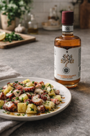 Piatto con insalata di polpo e patate condita con balsamico bianco barricato Acetaia Castelli