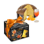 Italian Panettone Spritz cake with festive packaging, orange slices, and a Spritz cocktail